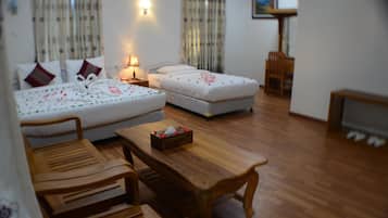 Family Room | Minibar, desk, blackout curtains, iron/ironing board