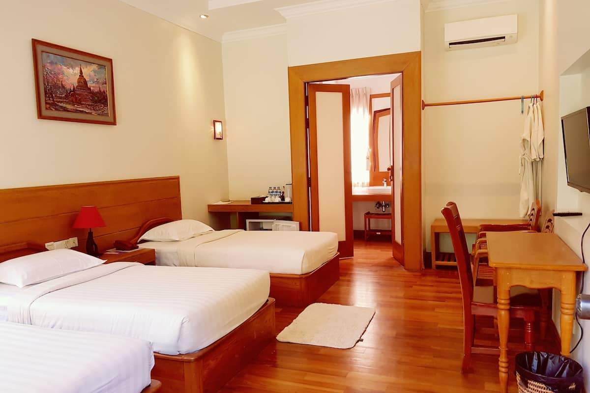 family room | minibar, desk, blackout curtains, iron/ironing board