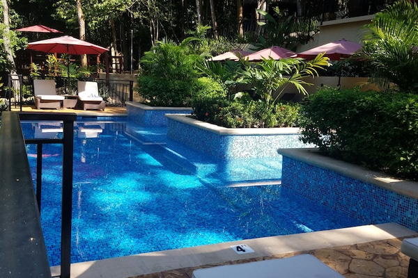 Outdoor pool, pool umbrellas, sun loungers