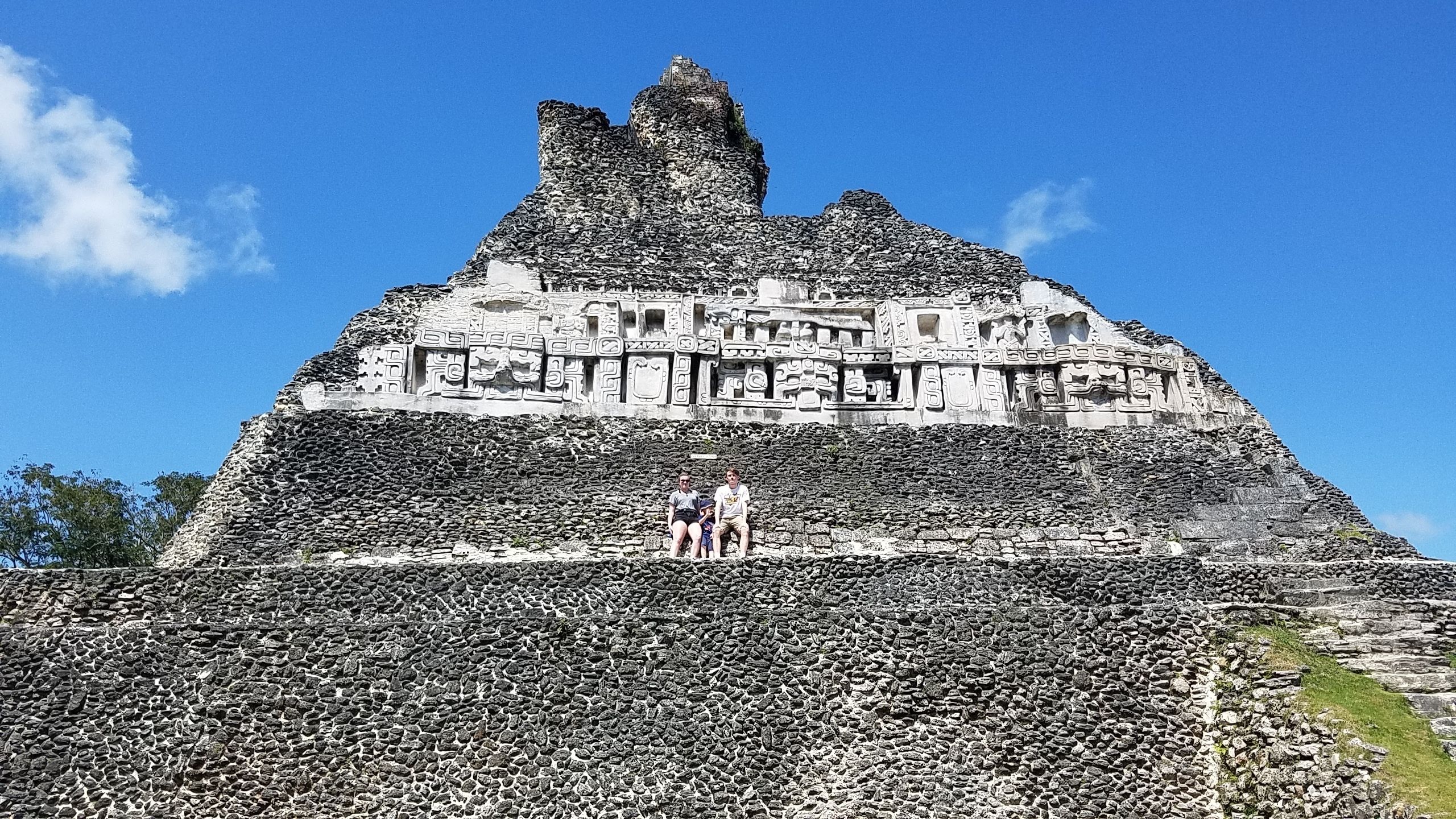 A large pyramid-like structure with intricate carvings and a flat top.