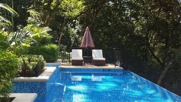 Outdoor pool, pool umbrellas, sun loungers