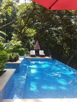 Outdoor pool, pool umbrellas, pool loungers