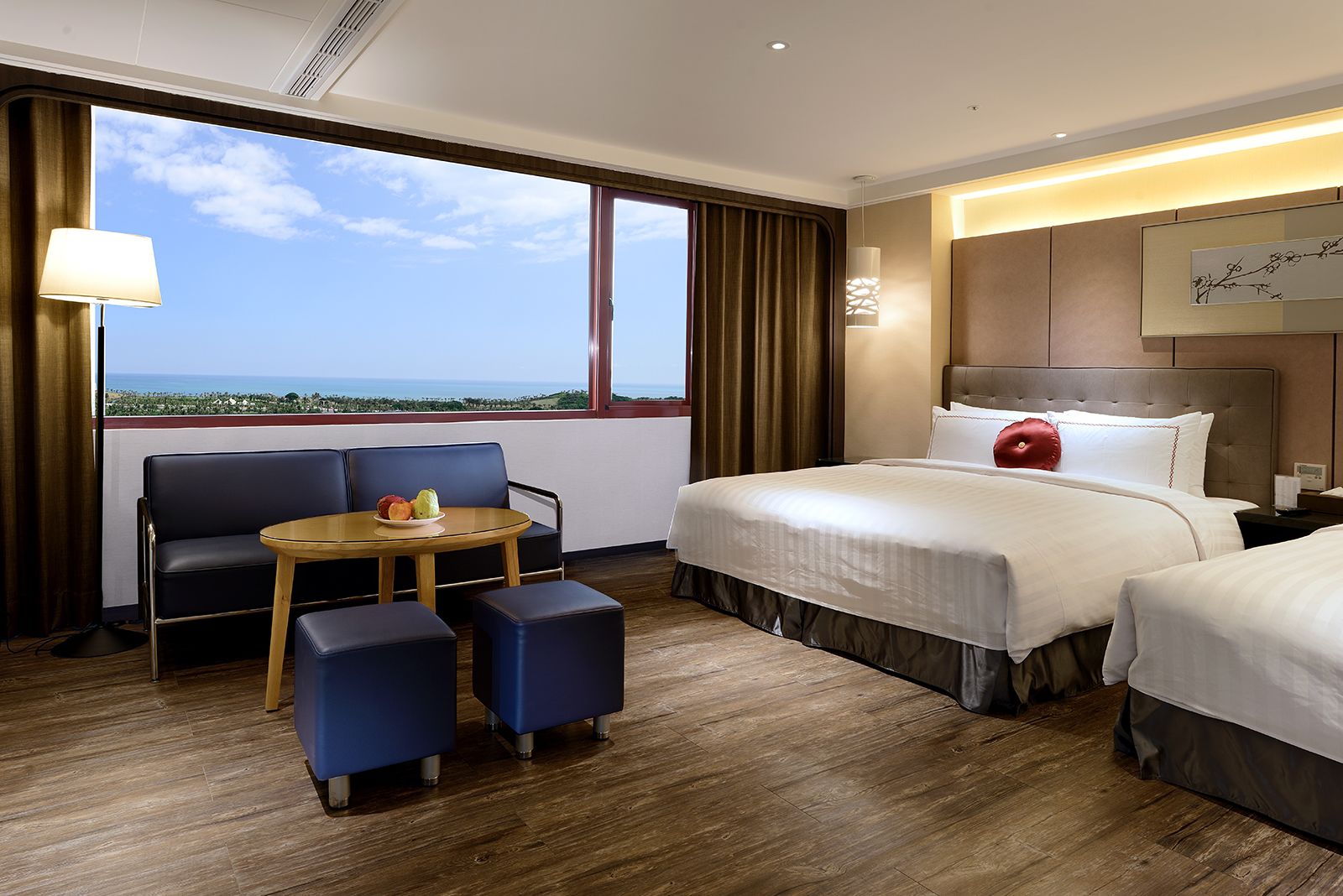 deluxe quadruple room | premium bedding, in-room safe, desk, blackout curtains