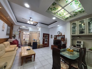 Family Villa (Holiday Home, 5 Rooms) | Living area | 32-inch flat-screen TV with cable channels, TV - Dongshan River Left bank B&B (Wujie)