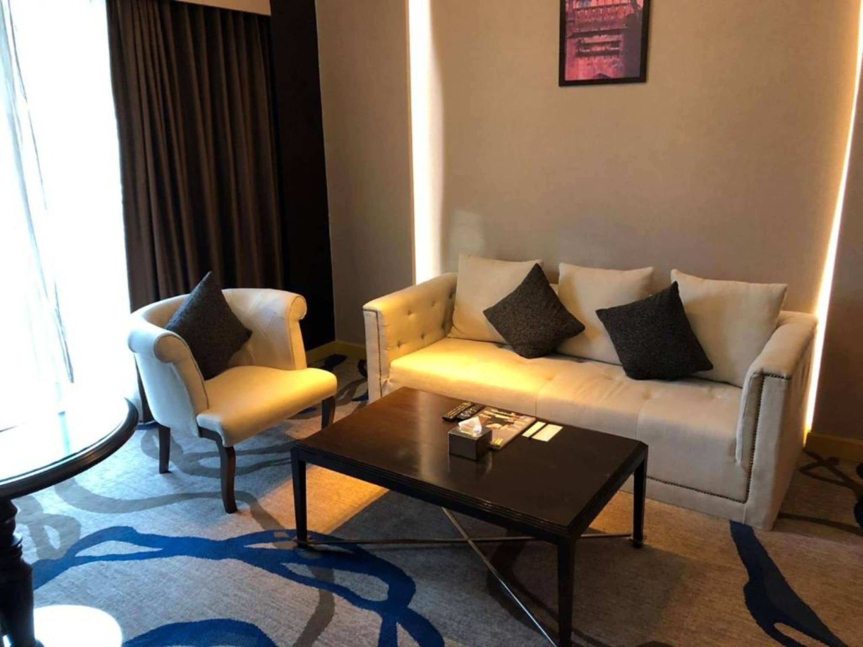 premium luxury suite | living room | 42-inch led tv with satellite channels, tv, fireplace