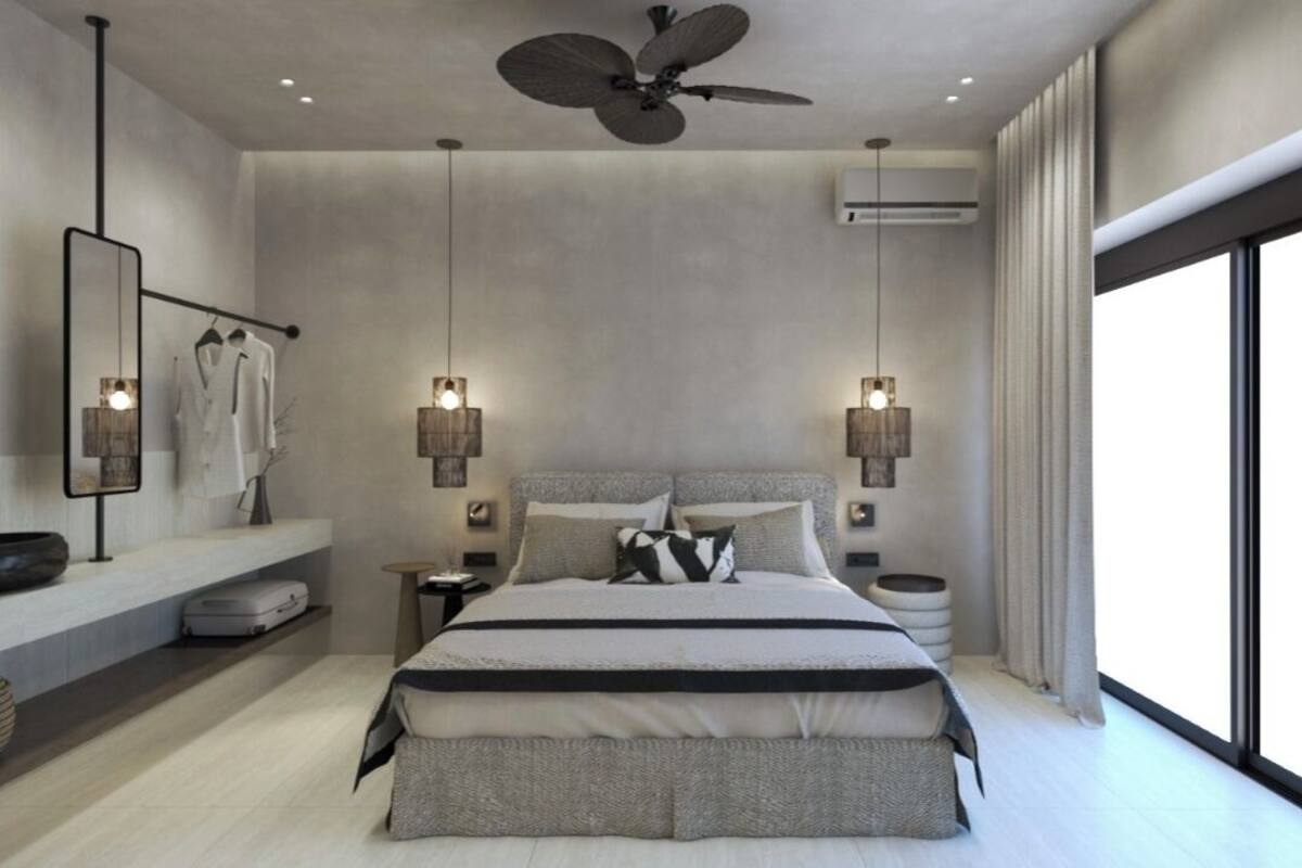 A modern bedroom with a large bed, two bedside tables, a ceiling fan, and a large window.