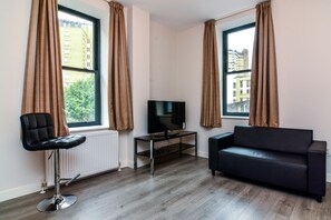 Premium Studio, 1 Double Bed | Living area | Flat-screen TV