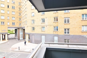 A multi-story building with a modern design, featuring a mix of brick and glass facades.