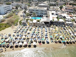 On the beach, sun loungers, beach umbrellas