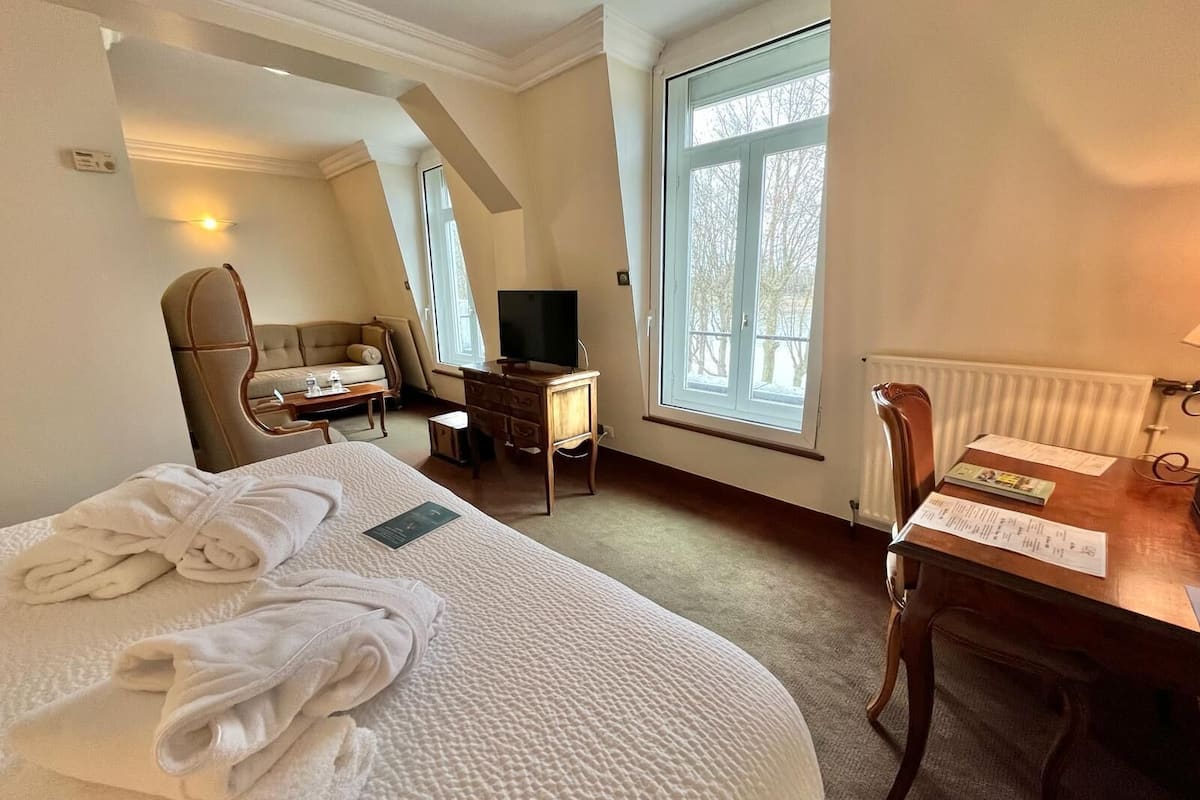 executive double room, 1 bedroom, private bathroom, river view | premium bedding, in-room safe, individually decorated, desk