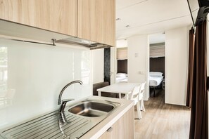 Premium Three-Bedroom Camping Home 6+1 | Private kitchen | Full-sized fridge, microwave, stovetop, coffee/tea maker
