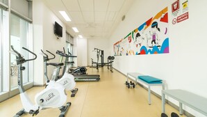 A gym with stationary bikes, treadmills, and weight equipment. - Hotel Campus Sanpaolo (Turin)