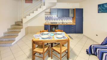 Apartment, 2 Bedrooms | Living area | 32-inch flat-screen TV with digital channels