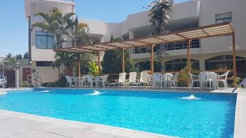 Outdoor pool, pool umbrellas, pool loungers