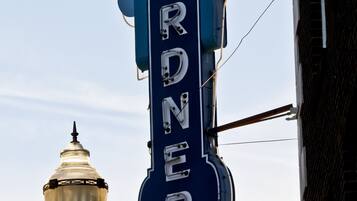 A vintage hotel sign with the name "HOTEL CARDNER" prominently displayed.