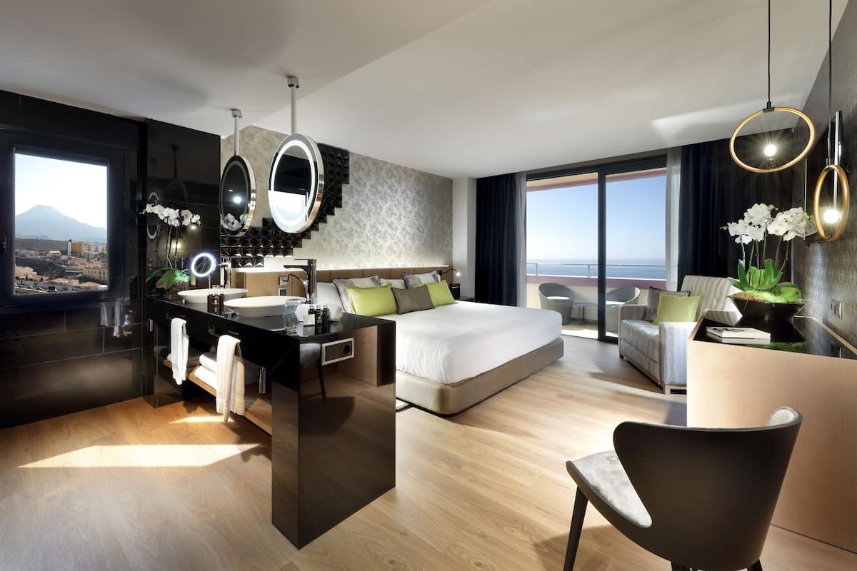 designer toiletries, hair dryer, bathrobes, slippers