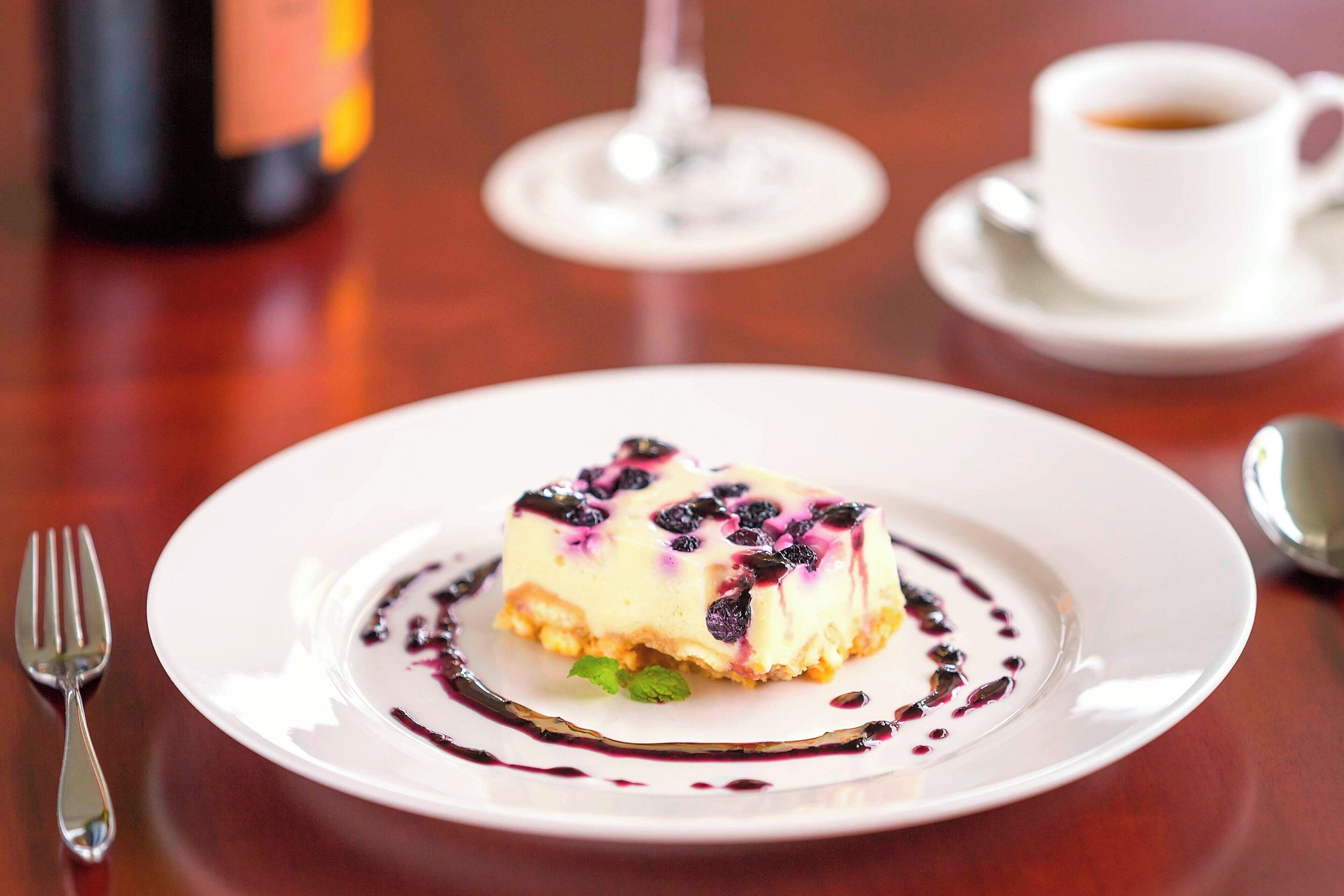 A dessert on a white plate with a fork beside it.