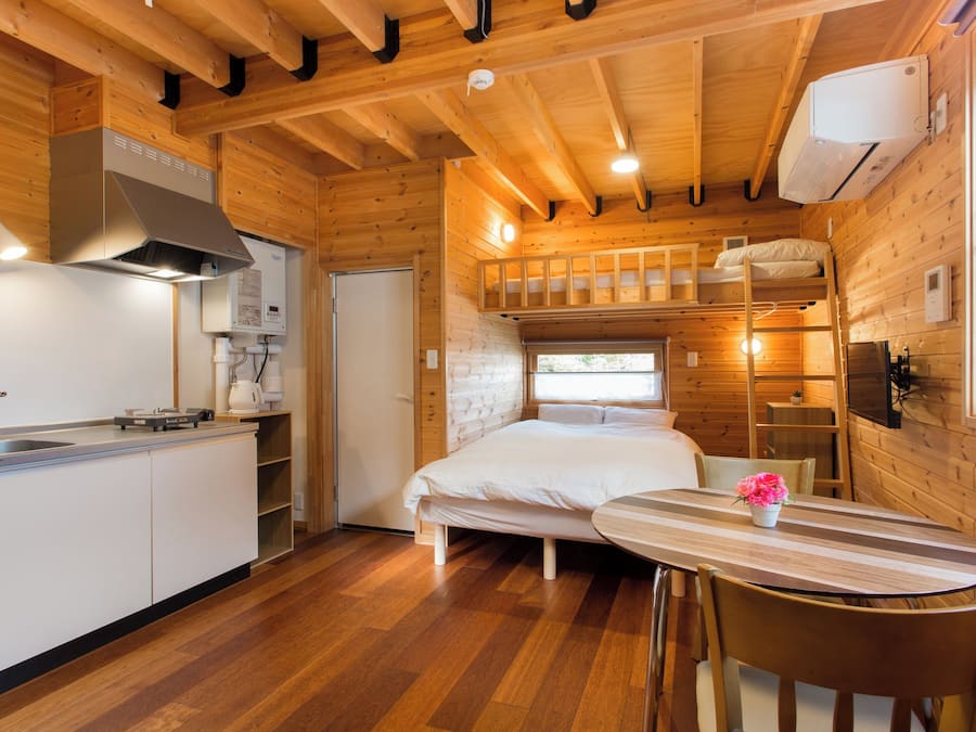 Room with double bed and loft bed (with kitchen)non-smoking | Living area | Flat-screen TV