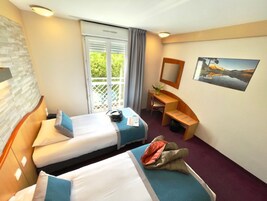 Comfort Twin Room | Premium bedding, desk, iron/ironing board, rollaway beds