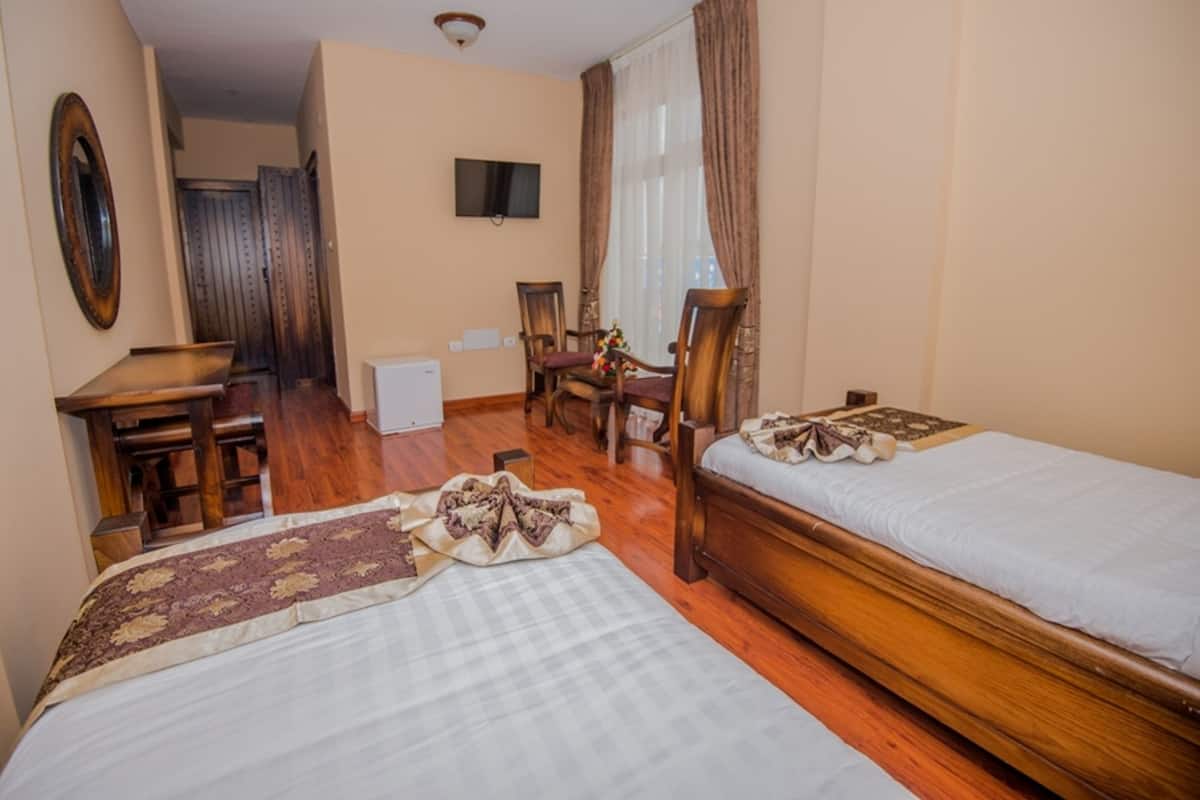 family room, 2 bedrooms, connecting rooms, city view | minibar, in-room safe, desk, iron/ironing board