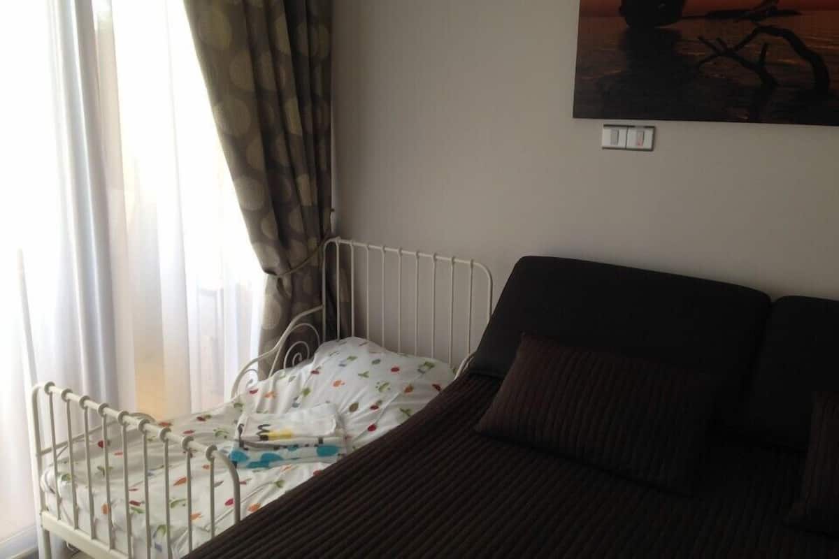 Apartment, 1 Bedroom, Sea View | In-room safe, iron/ironing board, free cots/infant beds, free WiFi