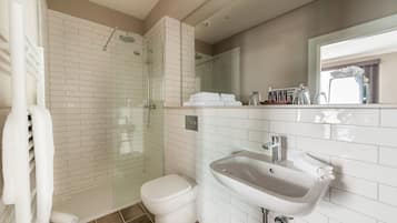 Shower, designer toiletries, hair dryer, bathrobes