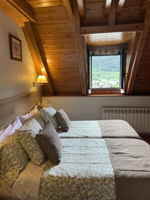 Basic Twin Room | Down comforters, desk, blackout drapes, soundproofing