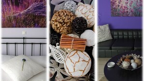 A bedroom with a white textured bed, a bedside table with a lamp, and a view of lavender fields. - Flower Pot Complex (Preveza)