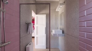A modern bathroom with a glass shower enclosure, a white sink, and a towel rack.