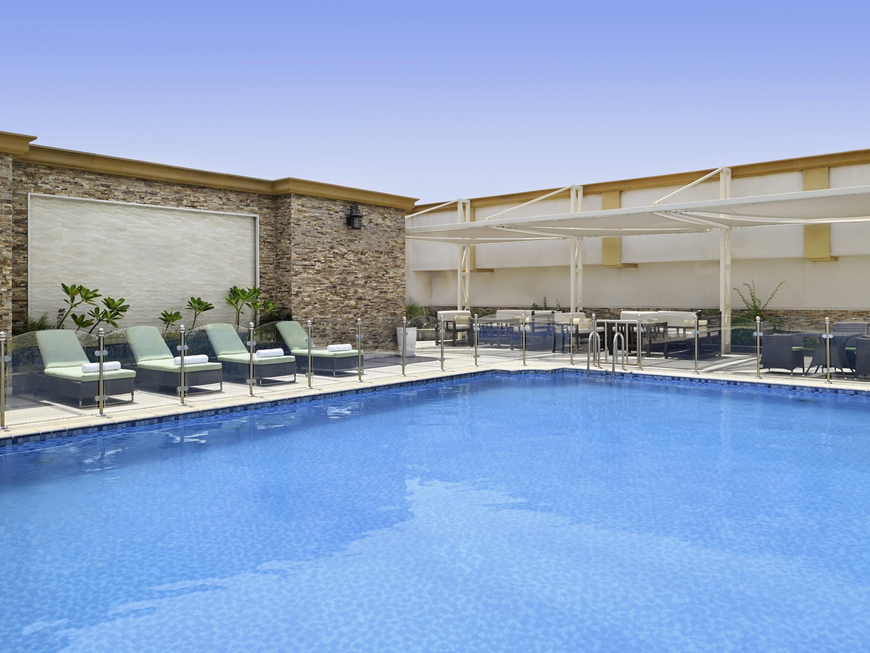 Outdoor pool, open 6:00 AM to 5:00 PM, pool umbrellas, sun loungers