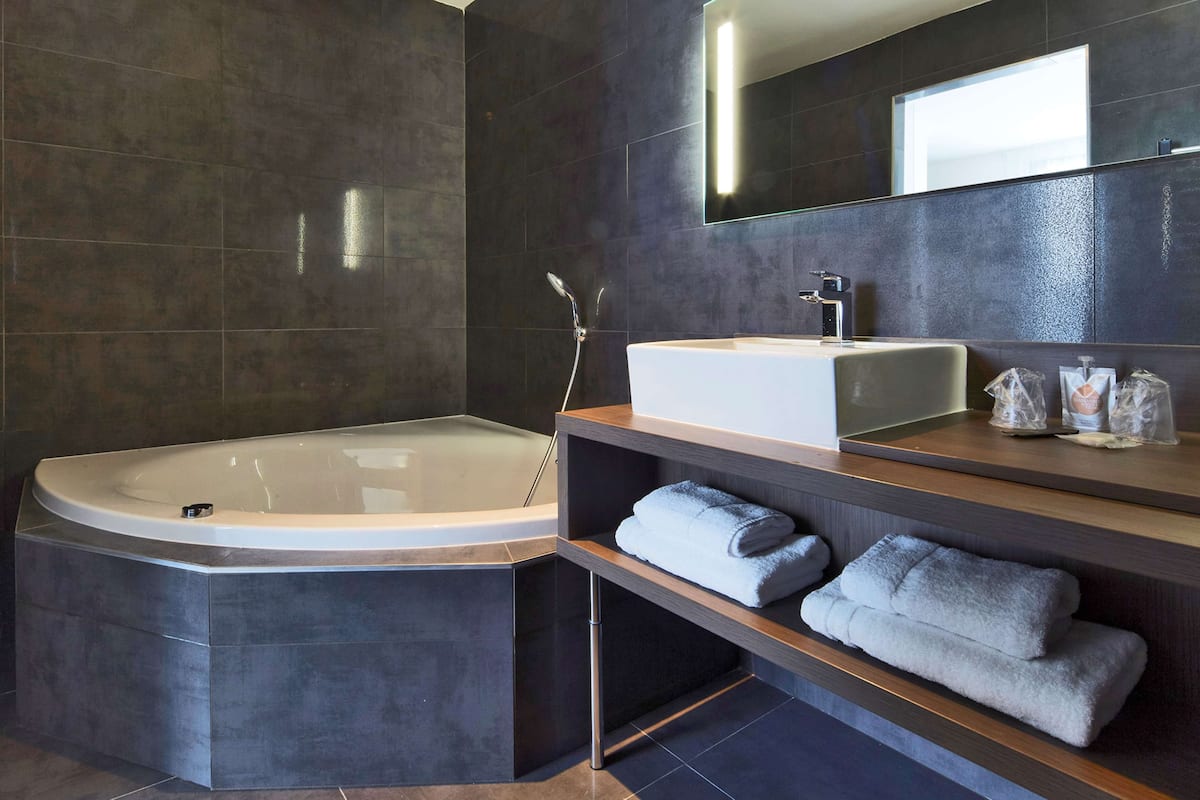 superior room, 2 double beds | bathroom | eco-friendly toiletries, hair dryer, bathrobes, towels