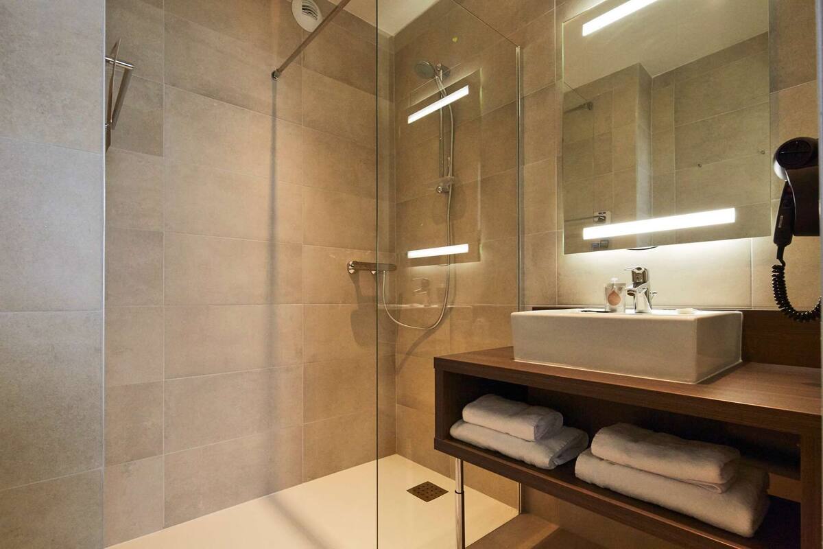 eco-friendly toiletries, hair dryer, bathrobes, towels