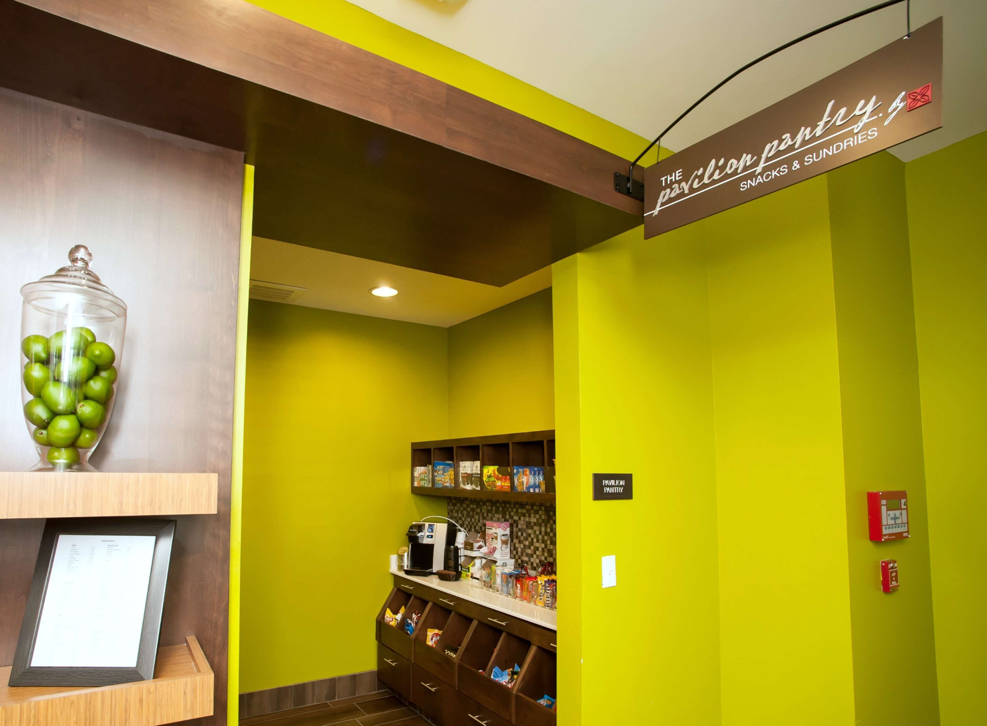 A food service area with a sign for 'The Pavilion Pantry' offering snacks and sundries.