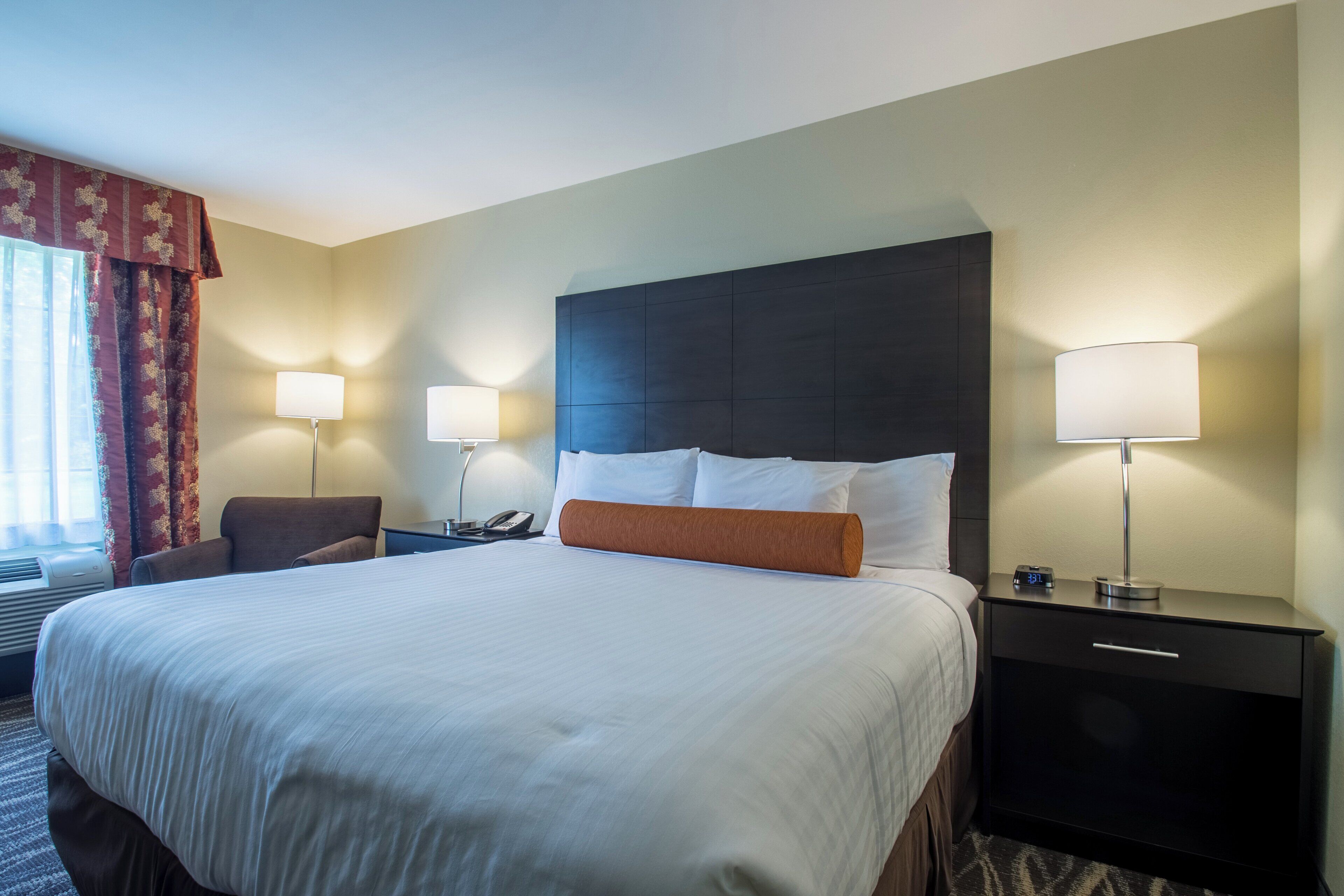 premium bedding, pillow-top beds, desk, laptop workspace