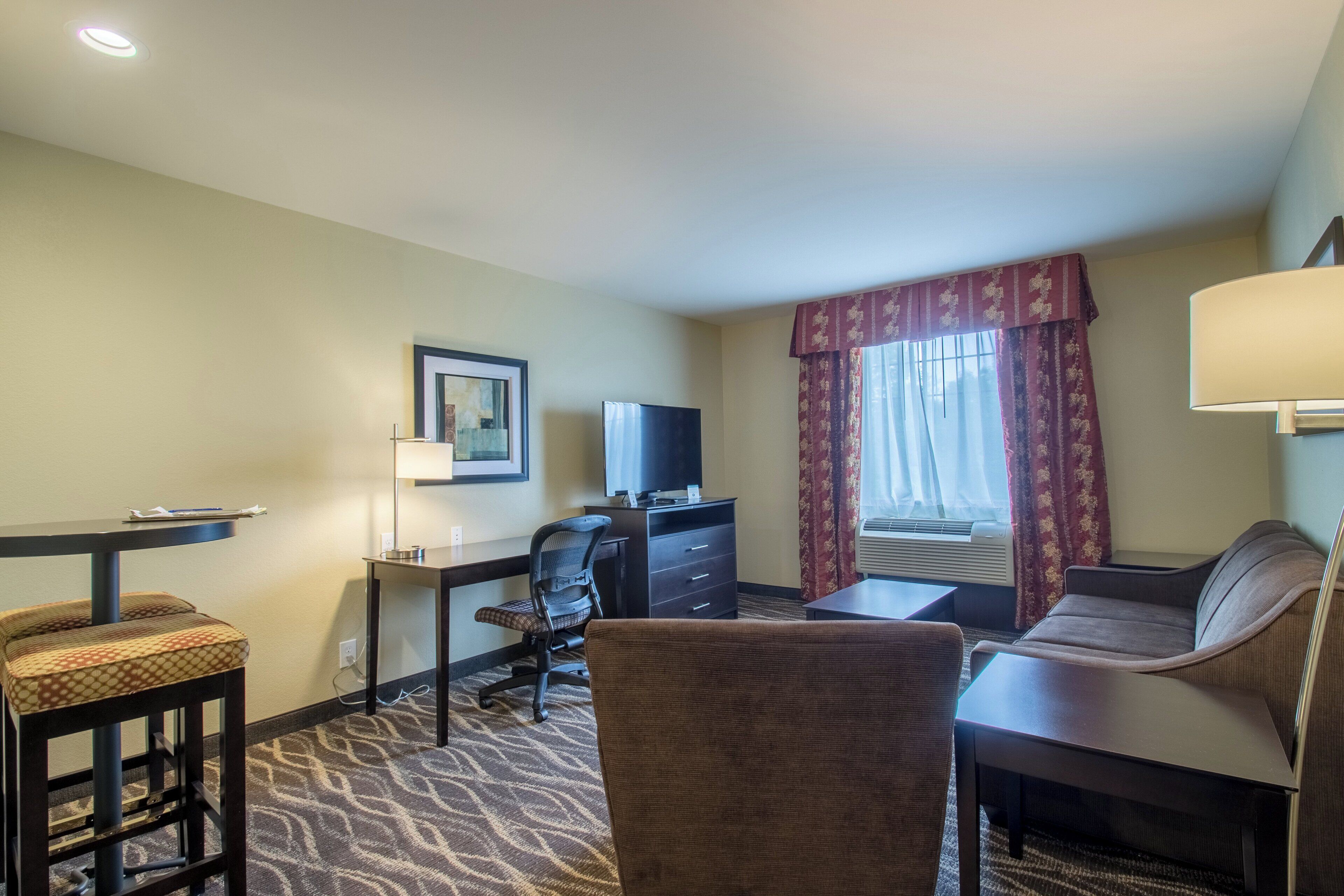 premium bedding, pillow-top beds, desk, laptop workspace