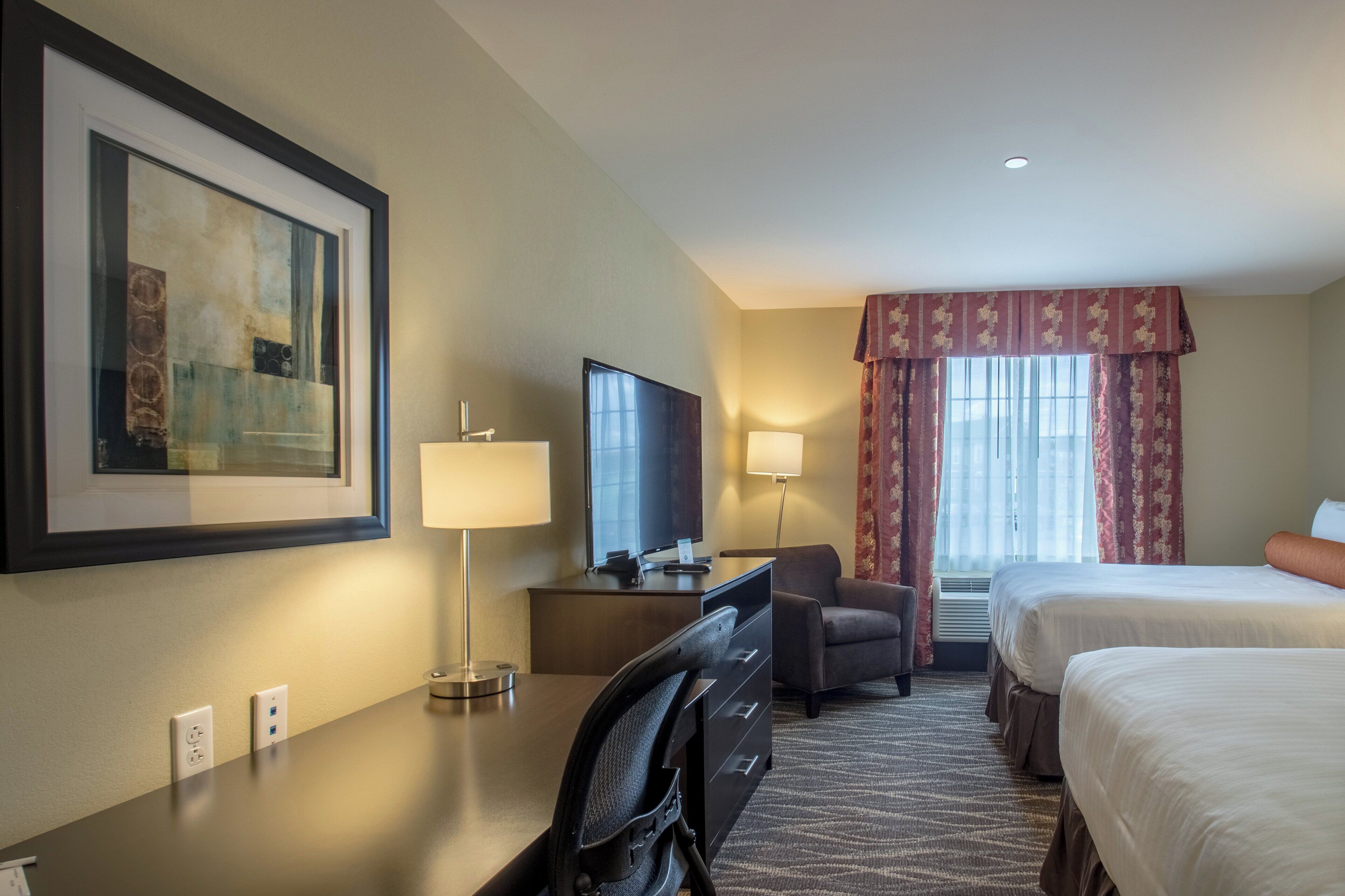 premium bedding, pillow-top beds, desk, laptop workspace