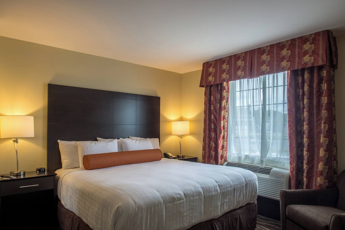 premium bedding, pillow-top beds, desk, laptop workspace