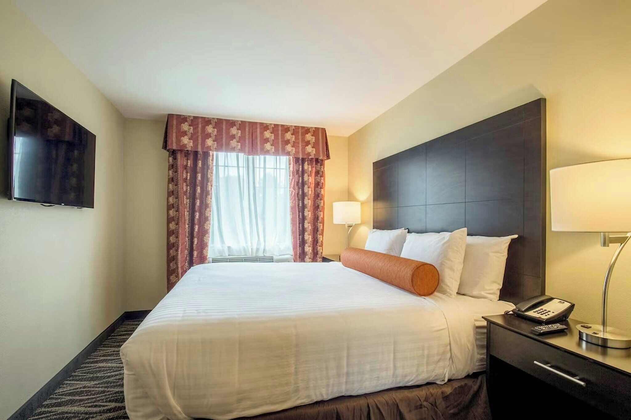 Premium bedding, pillow-top beds, desk, laptop workspace