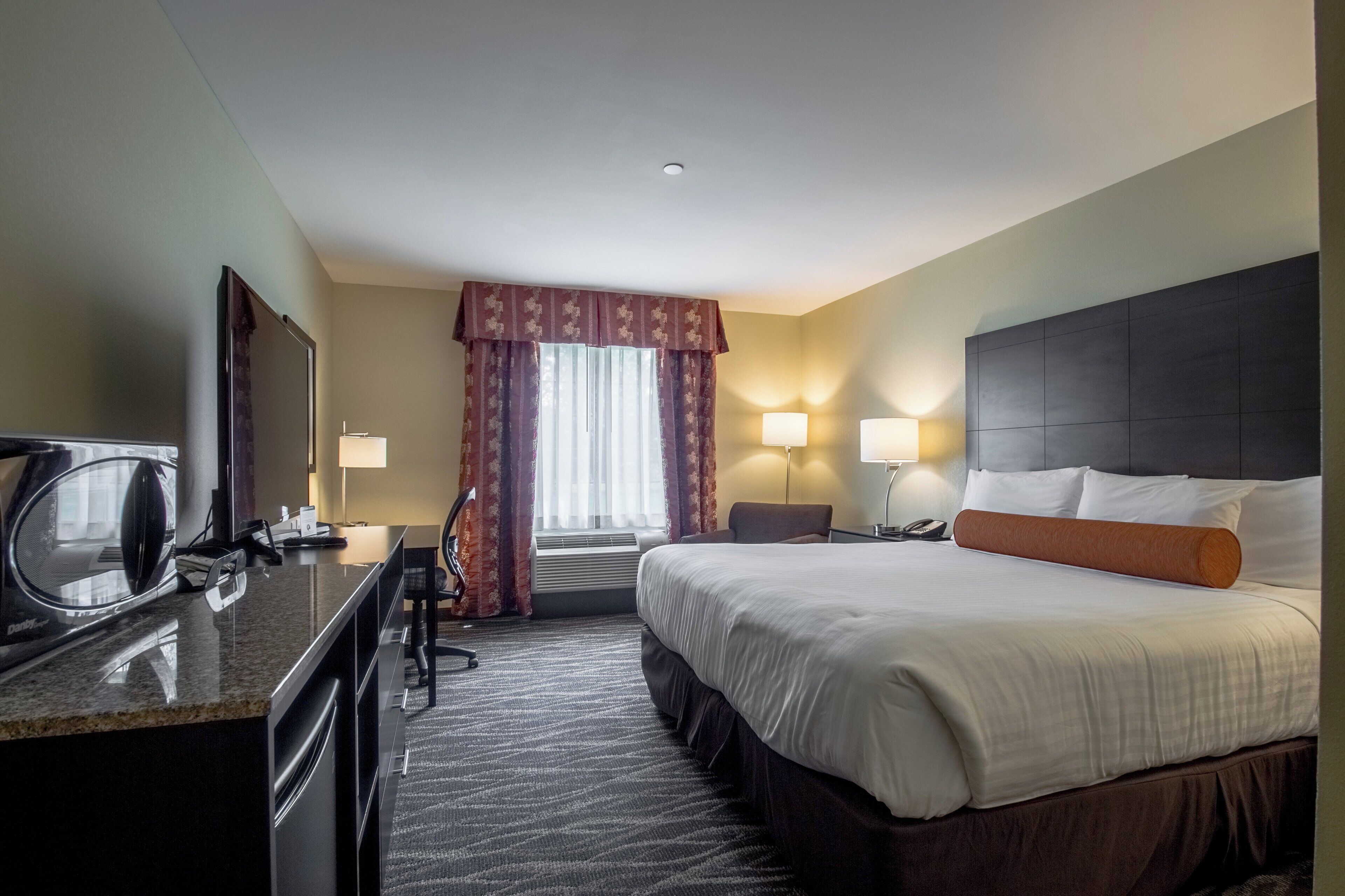 premium bedding, pillow-top beds, desk, laptop workspace