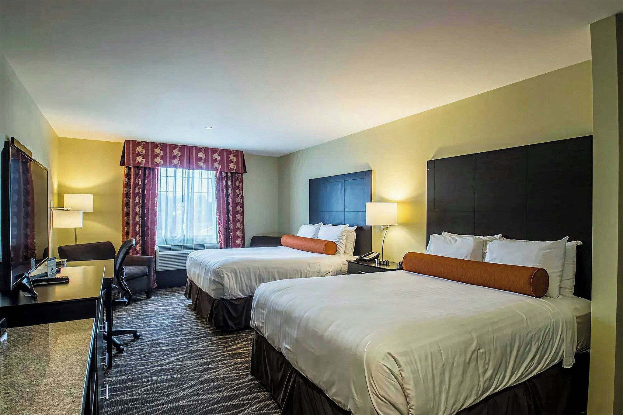 Premium bedding, pillow-top beds, desk, laptop workspace
