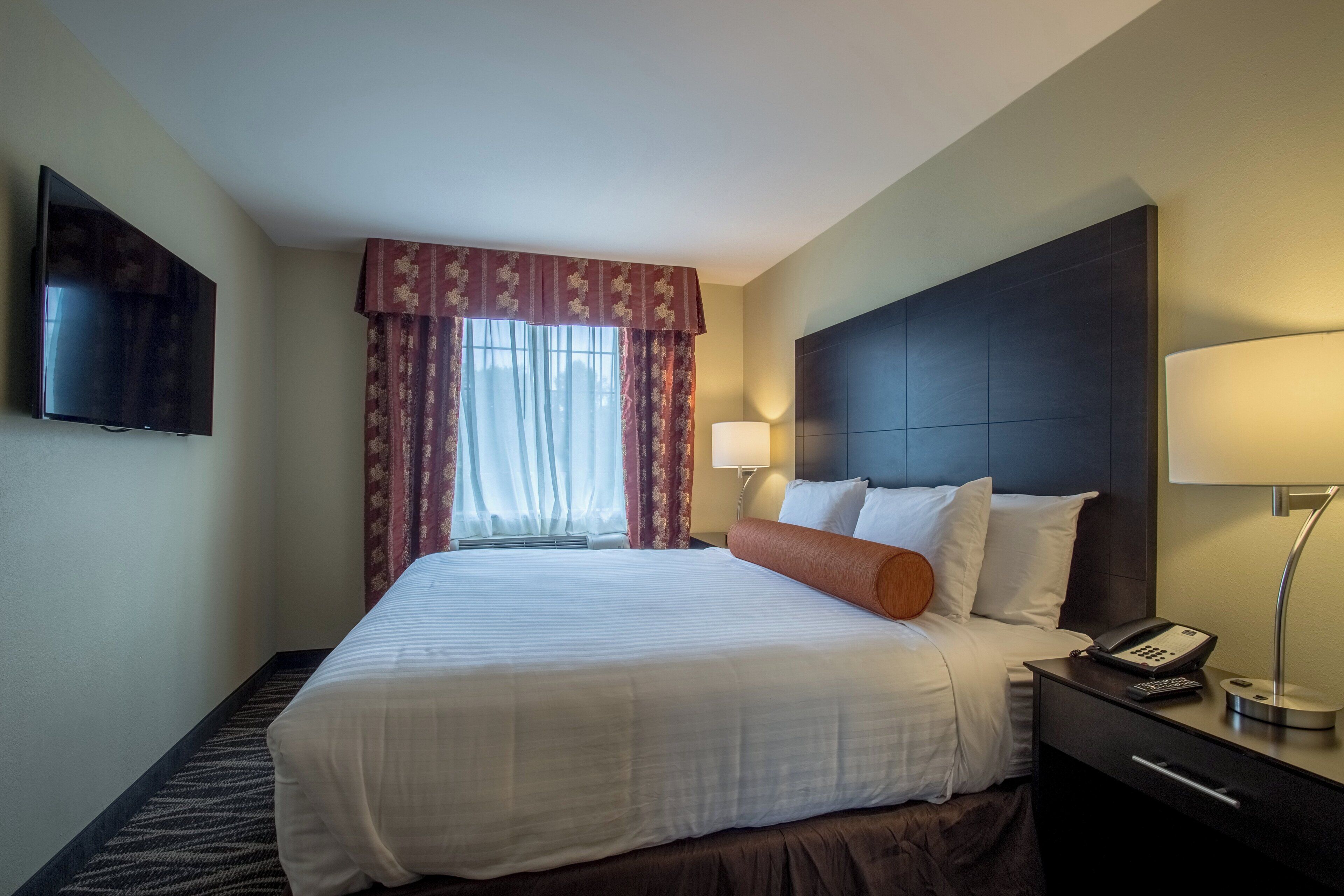 premium bedding, pillow-top beds, desk, laptop workspace