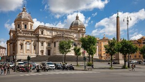 A large historic building with two prominent domes and a tall obelisk in front. - Daplace - Hotel Gran Torino Suites (Rome)
