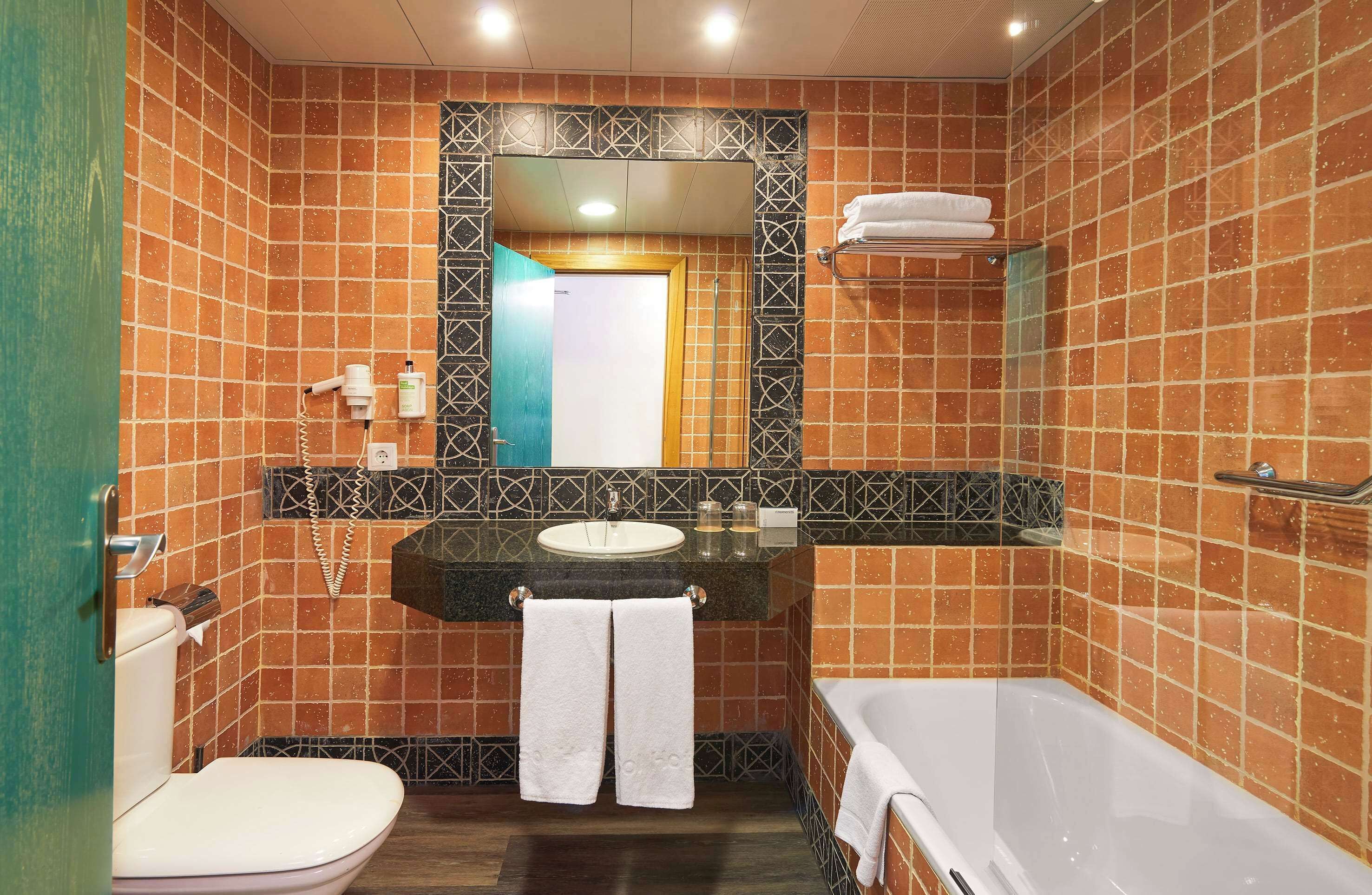 shower, eco-friendly toiletries, hair dryer, towels