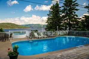 Seasonal outdoor pool, pool loungers