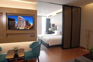 Hypo-allergenic bedding, free minibar items, in-room safe, desk