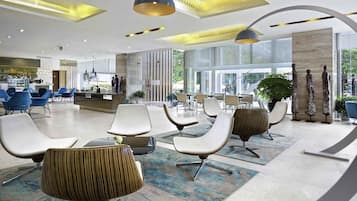 3 bars/lounges, rooftop bar, lobby lounge