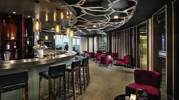 3 bars/lounges, rooftop bar, lobby lounge