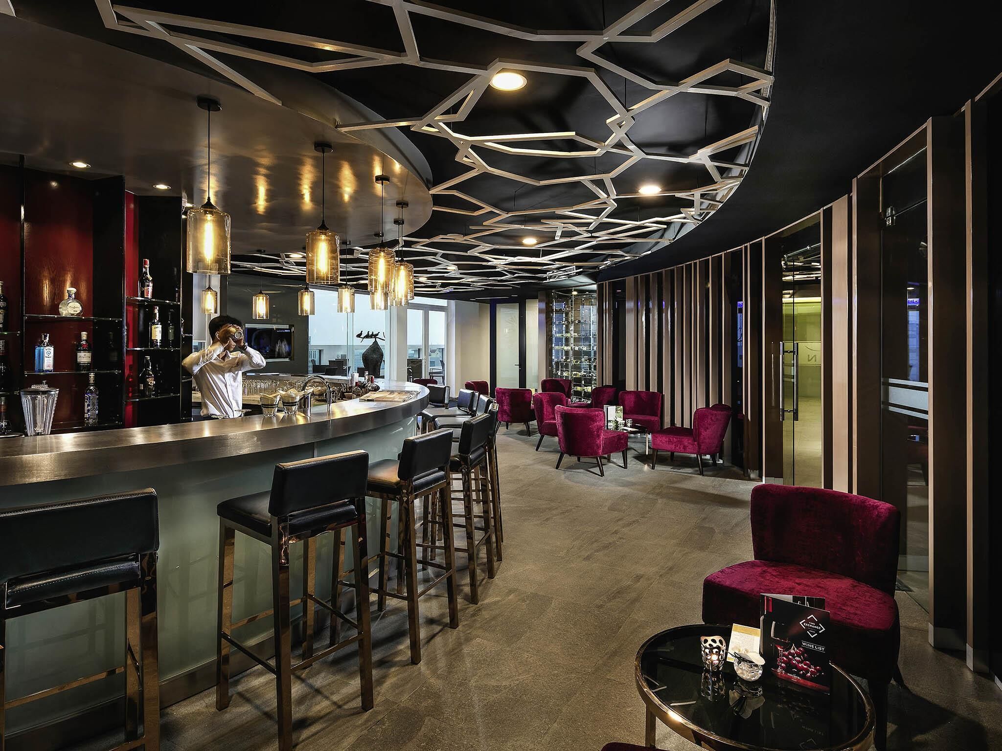 3 bars/lounges, rooftop bar, lobby lounge