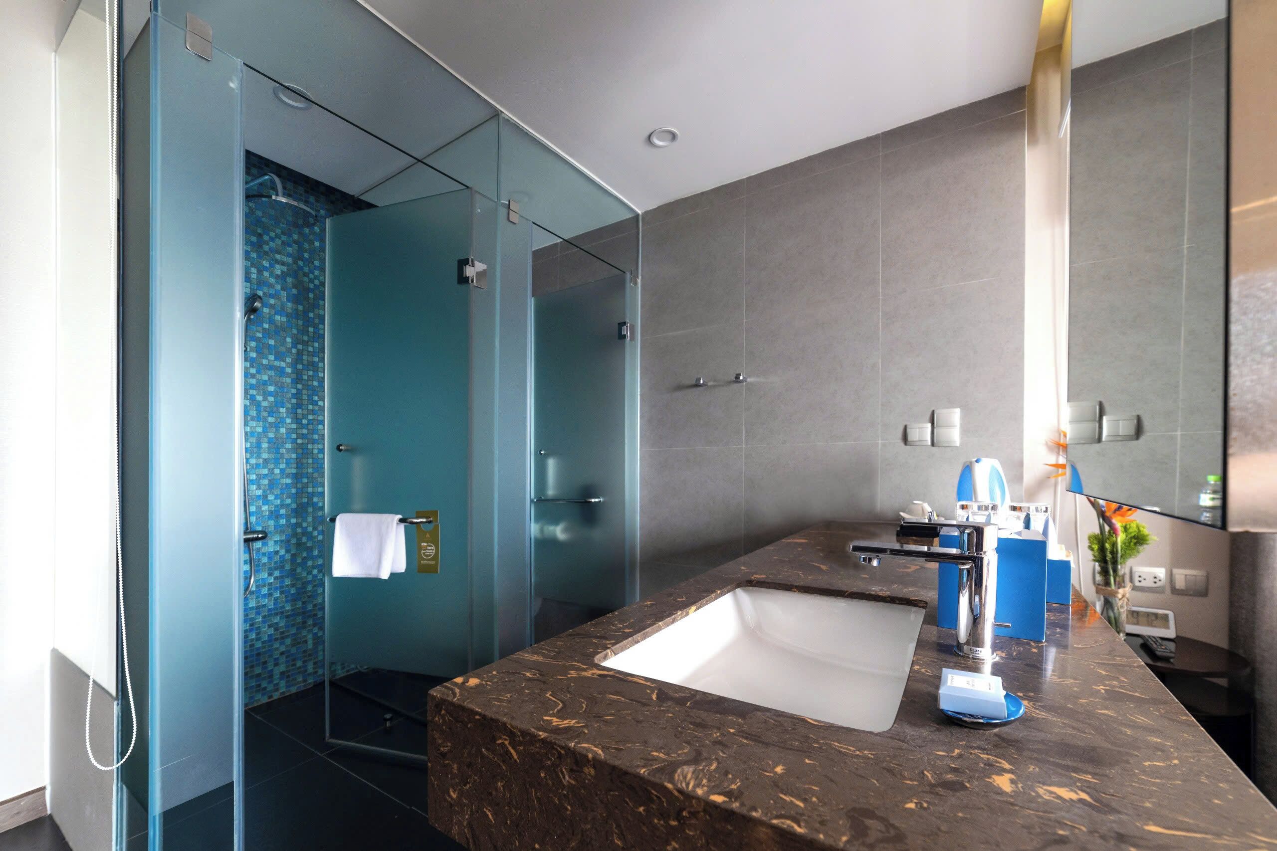 superior studio, 1 king bed | bathroom | rainfall showerhead, eco-friendly toiletries, hair dryer, bathrobes