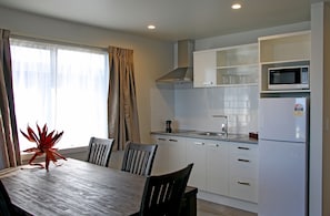 Superior 2 bedroom Apartment with lake view (Acacia wing) | Private kitchen | Mini-fridge, microwave, coffee/tea maker, electric kettle